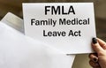 FMLA Family Medical Leave Act words written in letter from envelope Royalty Free Stock Photo