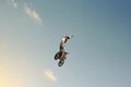 FMX biker jumping on a background of the sky