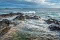 Foam in the sea from wave bursting on volcanic rocks of transparent sea at Ponta da Ferraria, SÃ£o Miguel - Azores PORTUGAL