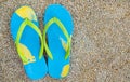 Foam beach sandle on sandy floor Royalty Free Stock Photo