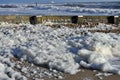 Foam on beach from waves