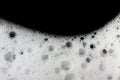 Foam bubbles abstract black background. Royalty Free Stock Photo