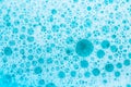 foam bubbles.Blue water with white foam bubbles.Cleanliness and hygiene background. Foam Soap Suds.Texture Foam Close-up Royalty Free Stock Photo