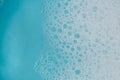 foam bubbles.Blue water with white foam bubbles.Foam Water Soap Suds.Texture Foam . Royalty Free Stock Photo