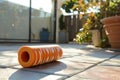 foam roller in use on patio, postworkout