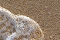 The foam of the sea on the sand, Royalty Free Stock Photo