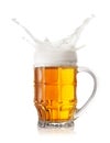 Foam splash in faceted beer mug Royalty Free Stock Photo