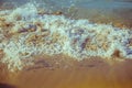 Foam wave of sea on sandy beach