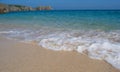 Foamed wave on the porthcurno sandy beach, pure water of celtic sea, summer in the Cornwall, South West End, UK Royalty Free Stock Photo