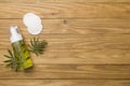 Foaming facial cleanser and cotton pads on wooden background, top view Royalty Free Stock Photo