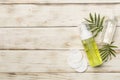 Foaming facial cleanser and micellar water on wooden background, top view Royalty Free Stock Photo