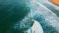 Foaming ocean water washing beautiful sand seashore. Aerial view stormy waves Royalty Free Stock Photo