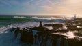 Foaming sea breaking stones slow motion. Aerial view stormy ocean crashing rocks Royalty Free Stock Photo