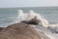 Foaming waves crashing against a rock in la Tranche-sur-Mer, France Royalty Free Stock Photo