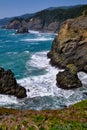 Foaming waves lash coastal cliffs near Brookings, Oregon