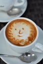 Foamy Cappuccino With Smile on A Black Background