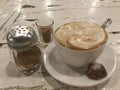 Foamy Latte. Coffee and cookie. Royalty Free Stock Photo