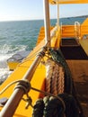 Wake of boat with coiled ropes