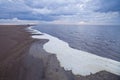 Foamy shore of Lake Ilmen. Royalty Free Stock Photo