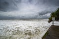 Foamy sore under dark cloudy skies in Alexandra Headland Beach, Queensland Australia