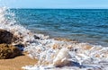 Foamy surf on sandy tropical beach