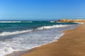 Foamy surf on sandy tropical beach Royalty Free Stock Photo