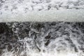 Foamy Surface of Running Water with an Unusual View - Abstract Natural Background