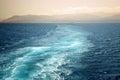 Foamy track behind the stern of the ship