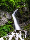 Foamy Valley Waterfall in Bucegi mountains accessible from Busteni town. Long exposure picture of a waterfall Royalty Free Stock Photo