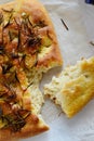 Focaccia bread decorated with salt and rosemary