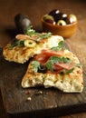 Focaccia bread with ham, rocket and olives Royalty Free Stock Photo