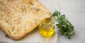 Focaccia bread with olive oil and oregano herb, freshly baked italian bread with ingredients Royalty Free Stock Photo