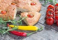 Focaccia with cherry tomatoes, fresh rosemary, peperone, selective focus