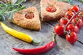Focaccia with cherry tomatoes, fresh rosemary, peperone, selective focus Royalty Free Stock Photo