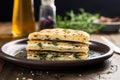 a focaccia sandwich with fresh thyme on a ceramic plate Royalty Free Stock Photo