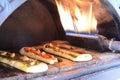 Focaccia with a variety of extras baked in a rectangular oven