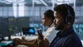 Focus on artificial intelligence server farm employee using mobile phone