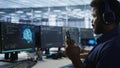 Focus on artificial intelligence server farm employee using mobile phone