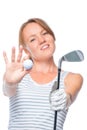 Focus on the ball and a golf club in the hands of charming girl Royalty Free Stock Photo