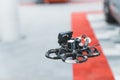 Focus on black first-person view drone with blurred background. Technology moving foreword. Drone flying over and Royalty Free Stock Photo