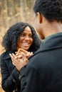 Loving black couple walking in park and enjoying autumn day Royalty Free Stock Photo