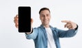 Focus on blank screen. Guy points finger at smartphone Royalty Free Stock Photo