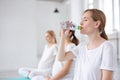 focus on blonde female drinking water after fitness Royalty Free Stock Photo