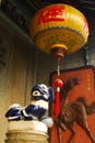Blue ceramic lion and Chinese lantern