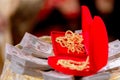 Focus bride price in Thai wedding ceremony, gold necklace, thai banknote and wedding rings. Asian Wedding Traditions.