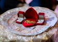 Focus bride price in Thai wedding ceremony, gold necklace, thai banknote and wedding rings.