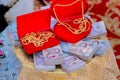 Focus bride price in Thai wedding ceremony, gold necklace, thai banknote and wedding rings. Asian Wedding Traditions.