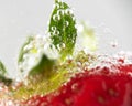 Focus of a bubbles surrounding a strawberry in a frizzy alcoholic drink