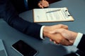 Focus business contract paper with blur background of handshake. Fervent Royalty Free Stock Photo