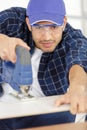 focus carpenter sawing wood board Royalty Free Stock Photo